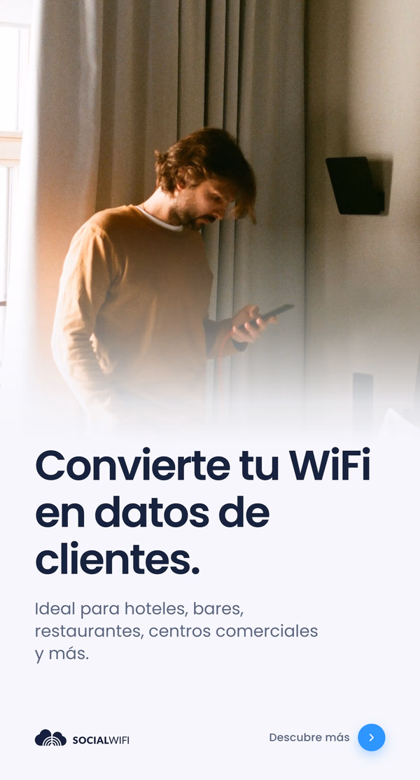 Hombre revisando su teléfono junto a un punto de acceso WiFi montado en la pared, bajo el titular 'Convierte tu WiFi en datos de clientes' y el texto 'Ideal para hoteles, bares, restaurantes, centros comerciales y más'