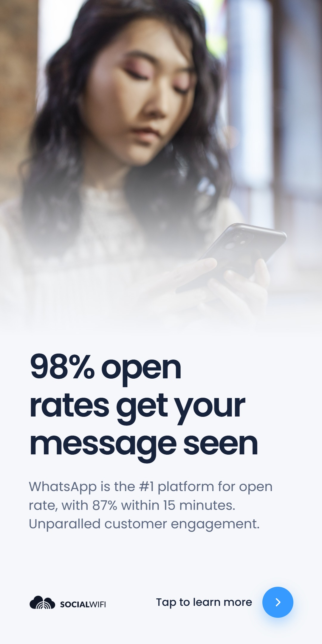 Woman checking her phone, under the headline '98% open rates get your message seen' and the line 'WhatsApp is the